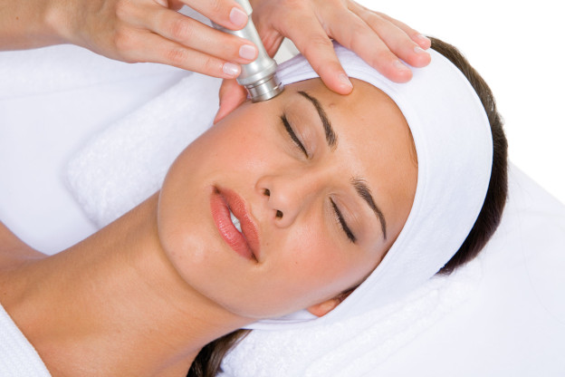 Microdermabrasion of facial skin in the grail salon