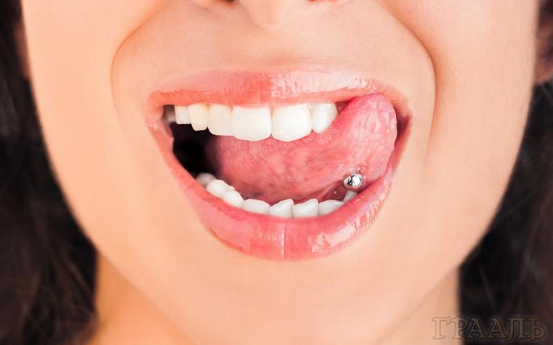 Tongue piercing in the Grail salon